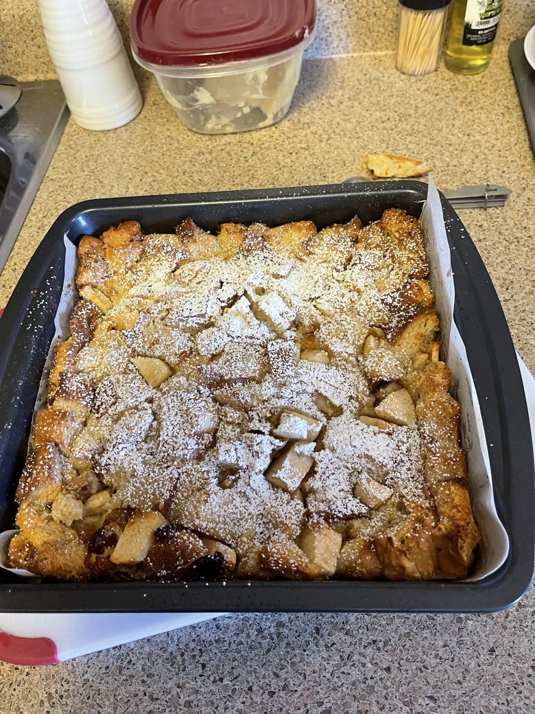 Apple bread pudding dusted with powdered sugar