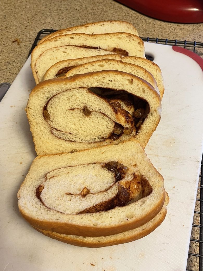 Sliced apple cinnamon swirl loaf with a visible cinnamon spiral