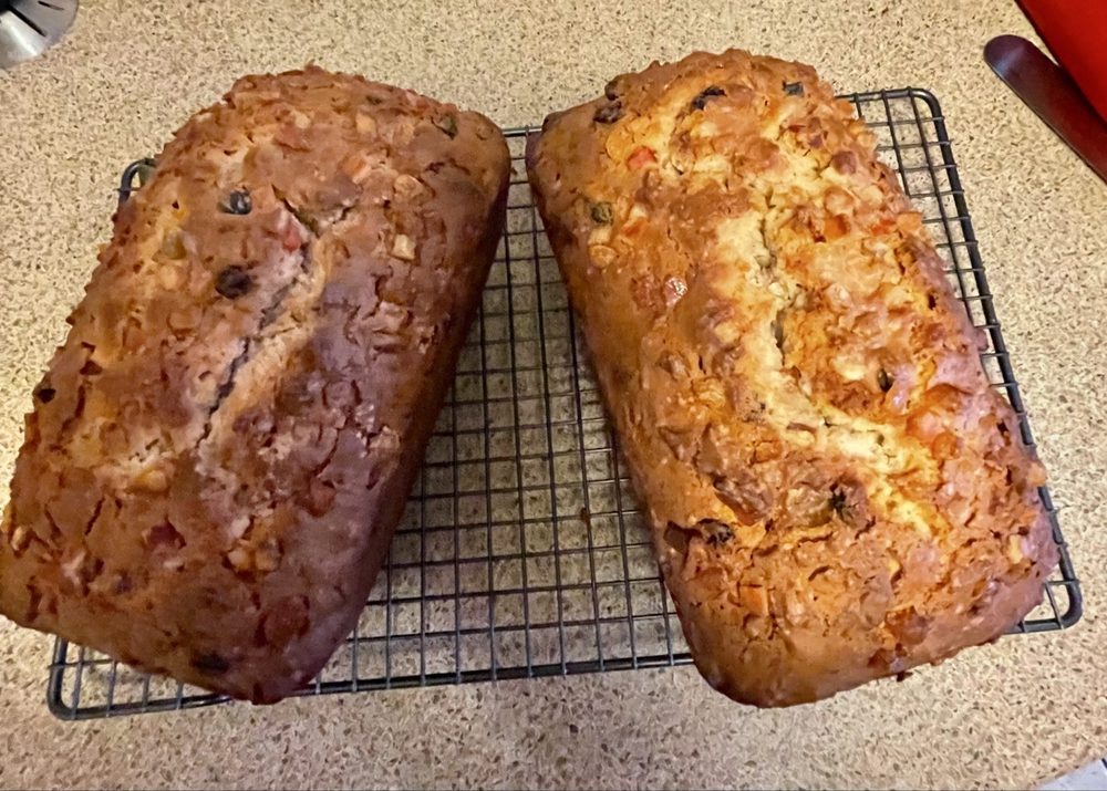 Two loaves of Bob's Bajan coconut bread cooling on a wire rack