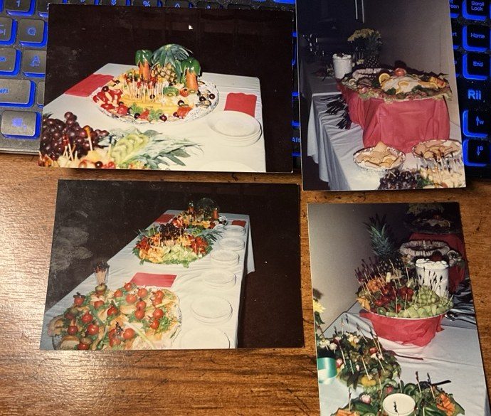 Four-photo collage of Bob's earlier catering work, including carved fruit and vegetables, a fruit palm tree centerpiece, and arranged banquet platters