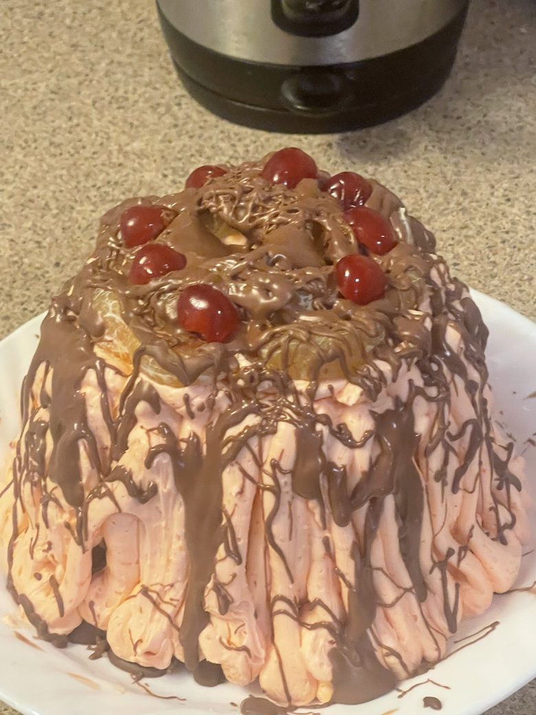Cherry chocolate mousse cake with chocolate drizzle