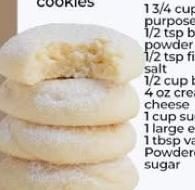 Stack of cream cheese cookies dusted with powdered sugar