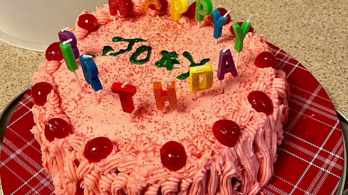 Birthday cake with cherries shown in Bob's video