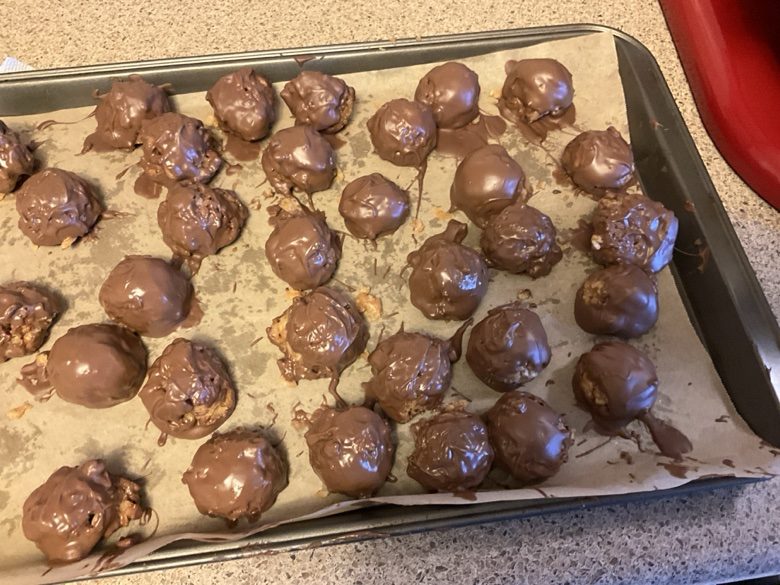 Tray of chocolate-coated peanut butter krispie balls