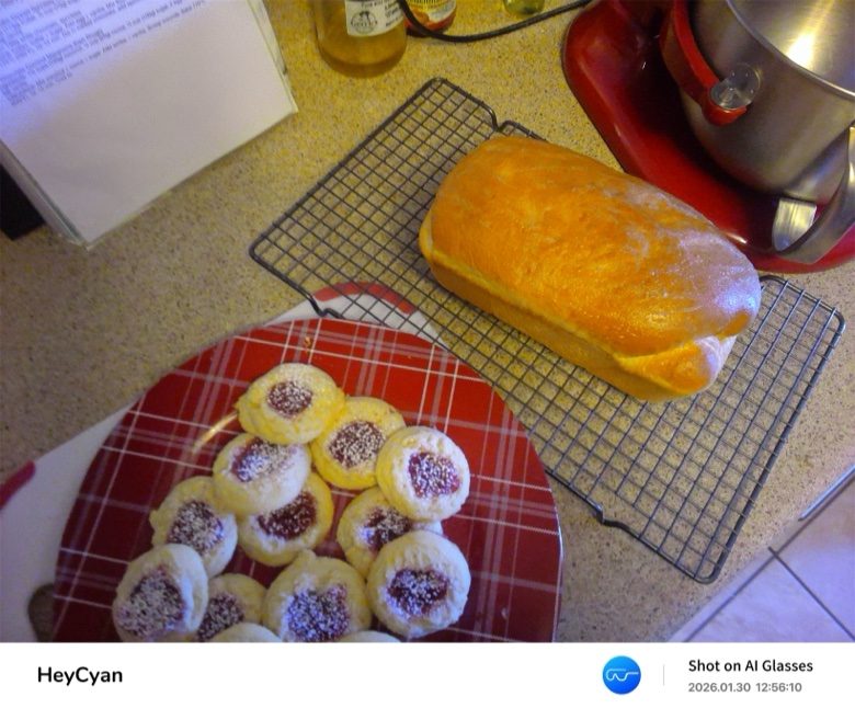 Jam-filled thumbprint cookies dusted with powdered sugar